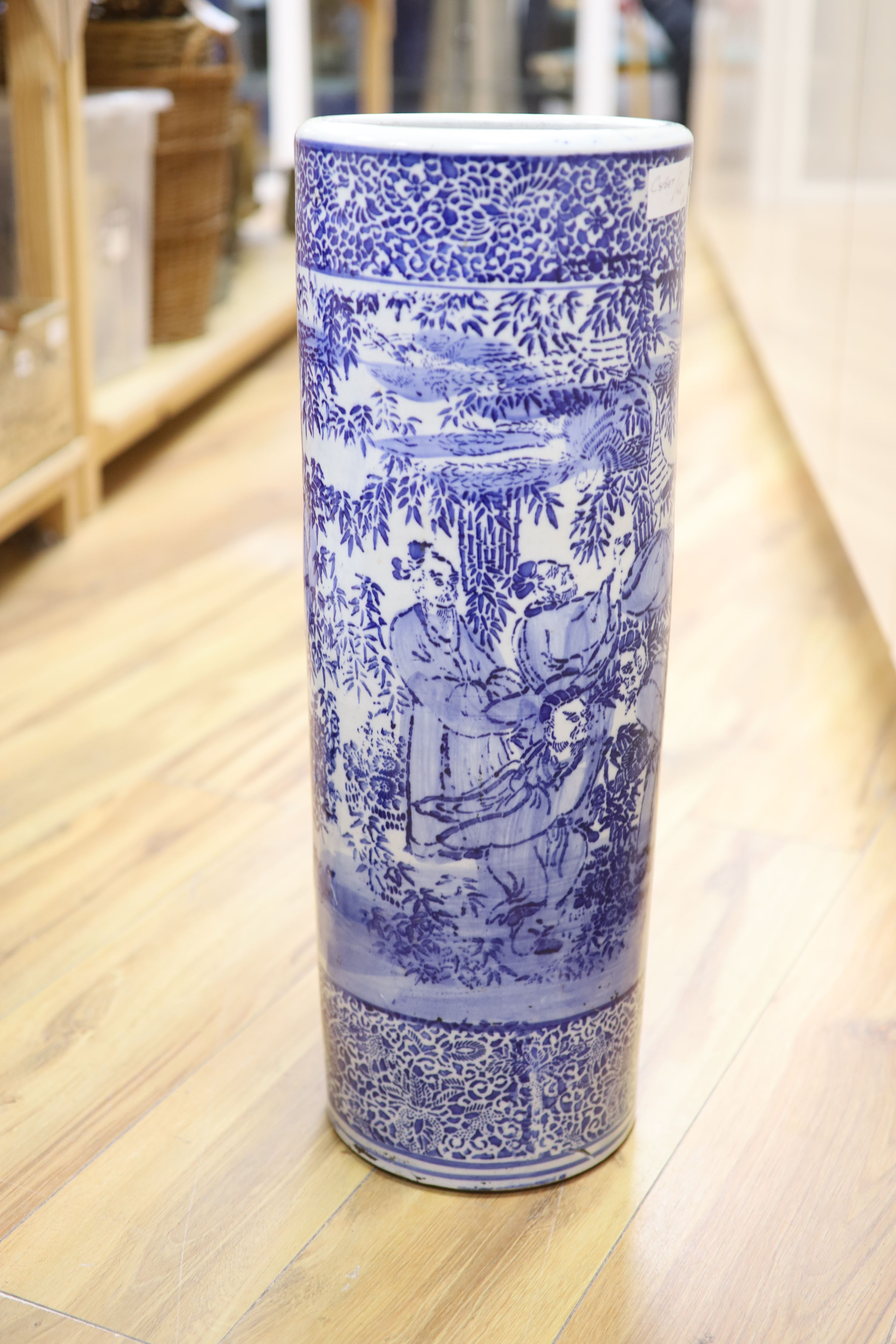 Two Chinese ceramic elephant garden seats and a blue and white stick stand, height 61cm